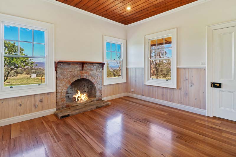 100-Year-Old Renovation - Renovated stone fireplace