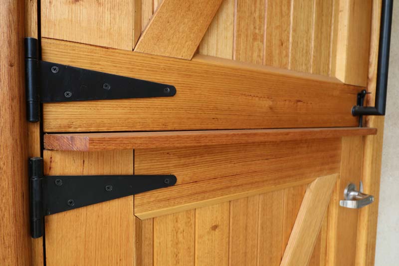 Rammed Earth and Heavy Timber Home door detail