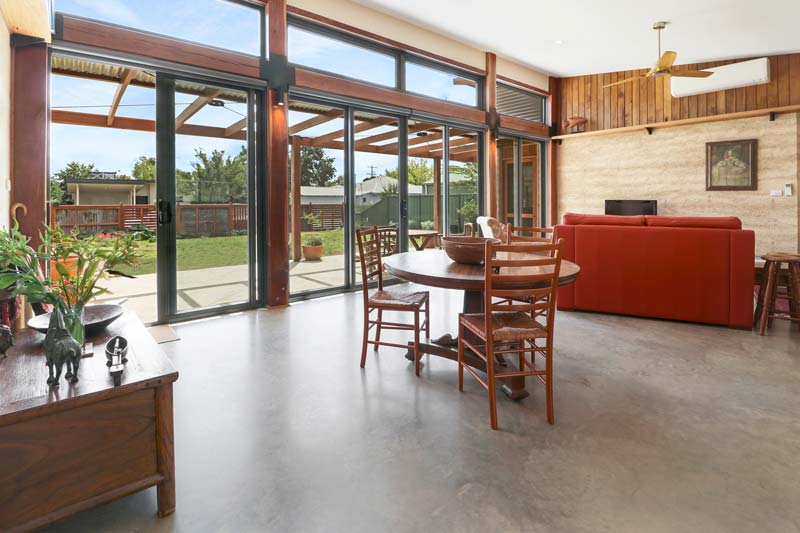 Rammed Earth and Heavy Timber Home Interior