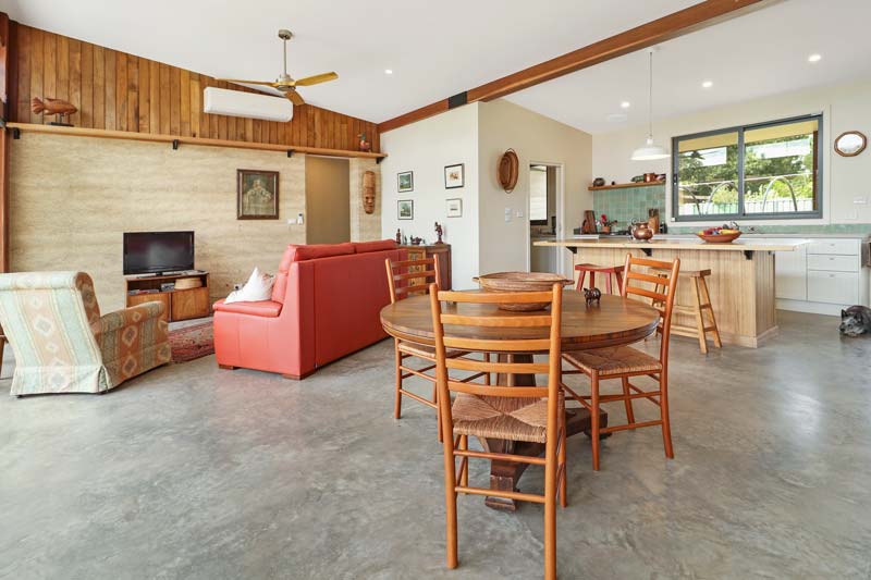 Rammed Earth and Heavy Timber Home Interior